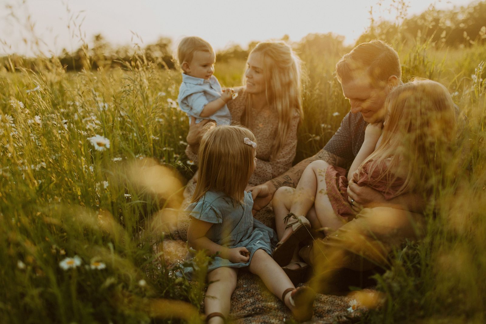 Jeremy Bundy with his wife and three young children in a sunlit field